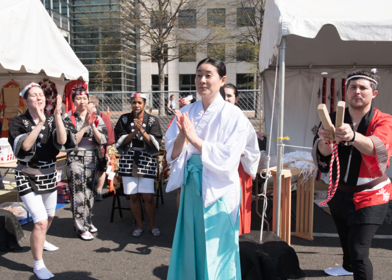 2018 Sakura Matsuri - Reverend Kuniko Kanawa leads students carrying a shrine in front of the U.S. Capitol Building.