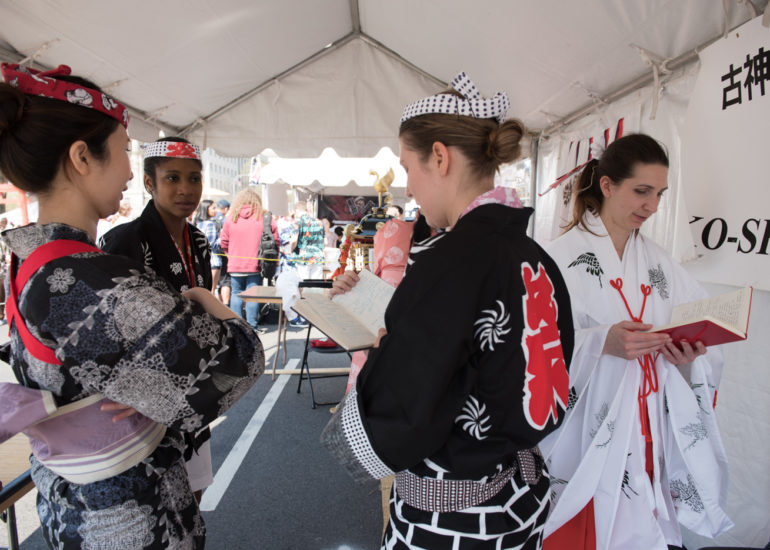 2018 Sakura Matsuri - Reverend Kuniko Kanawa leads students carrying a shrine in front of the U.S. Capitol Building.