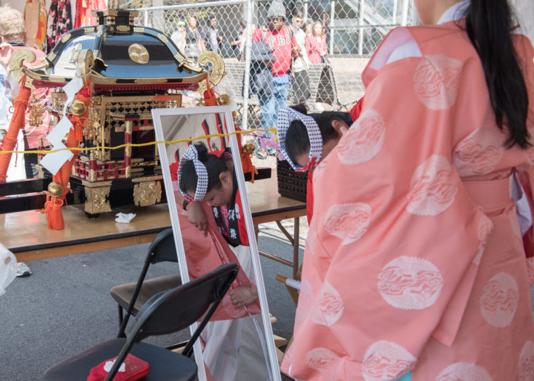 2018 Sakura Matsuri - Reverend Kuniko Kanawa leads students carrying a shrine in front of the U.S. Capitol Building.