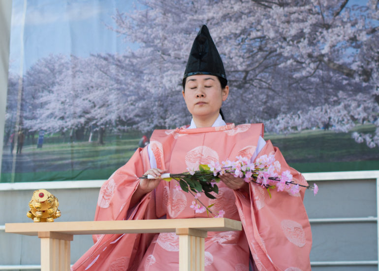 2018 Sakura Matsuri - Reverend Kuniko Kanawa leads students carrying a shrine in front of the U.S. Capitol Building.