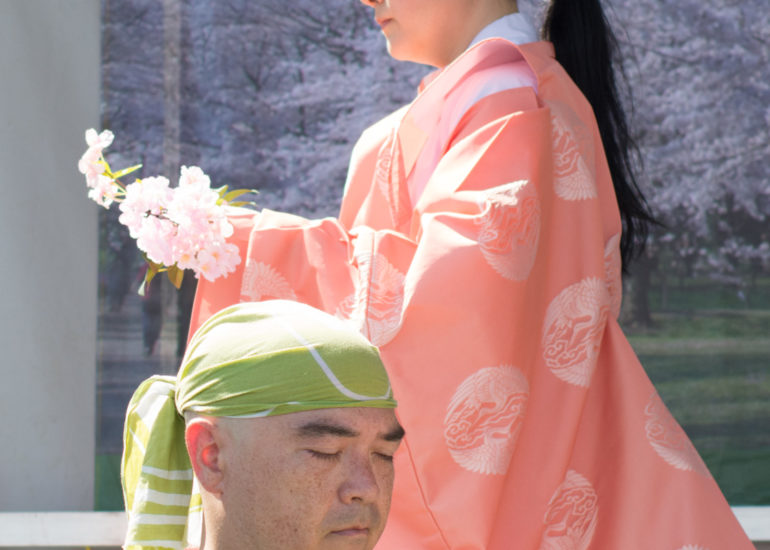 2018 Sakura Matsuri - Reverend Kuniko Kanawa leads students carrying a shrine in front of the U.S. Capitol Building.