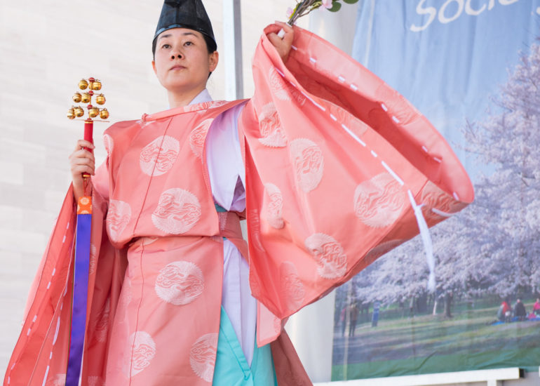 2018 Sakura Matsuri - Reverend Kuniko Kanawa leads students carrying a shrine in front of the U.S. Capitol Building.