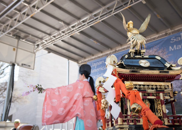 2018 Sakura Matsuri - Reverend Kuniko Kanawa leads students carrying a shrine in front of the U.S. Capitol Building.