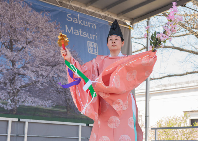 2018 Sakura Matsuri - Reverend Kuniko Kanawa leads students carrying a shrine in front of the U.S. Capitol Building.