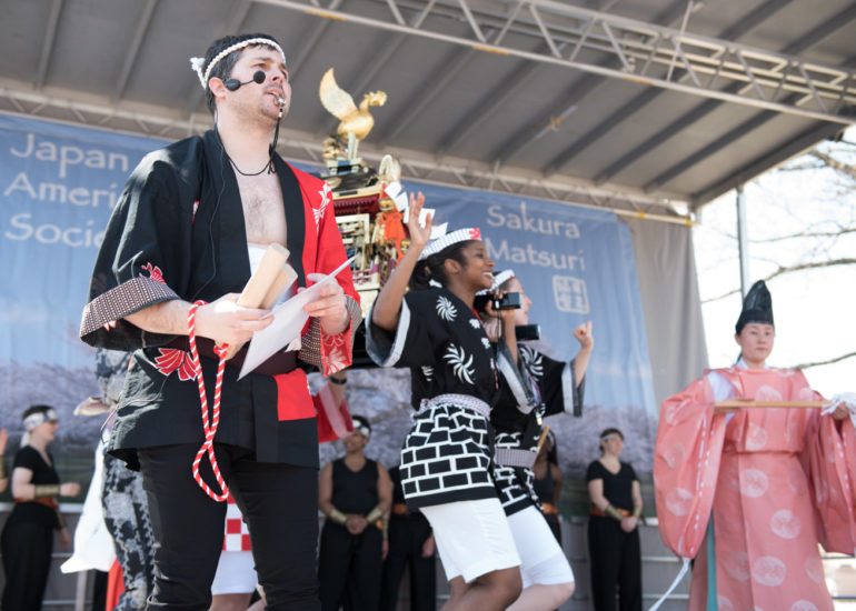 2018 Sakura Matsuri - Reverend Kuniko Kanawa leads students carrying a shrine in front of the U.S. Capitol Building.