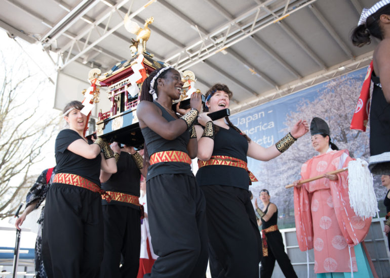 2018 Sakura Matsuri - Reverend Kuniko Kanawa leads students carrying a shrine in front of the U.S. Capitol Building.