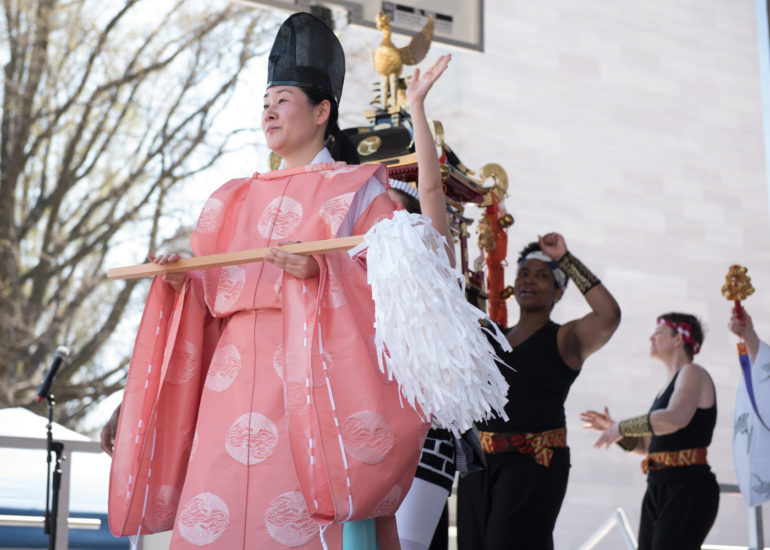 2018 Sakura Matsuri - Reverend Kuniko Kanawa leads students carrying a shrine in front of the U.S. Capitol Building.