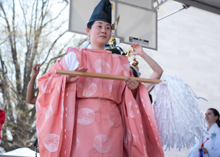 2018 Sakura Matsuri - Reverend Kuniko Kanawa leads students carrying a shrine in front of the U.S. Capitol Building.