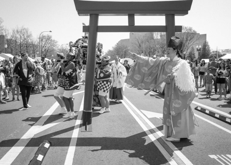 2018 Sakura Matsuri - Reverend Kuniko Kanawa leads students carrying a shrine in front of the U.S. Capitol Building.