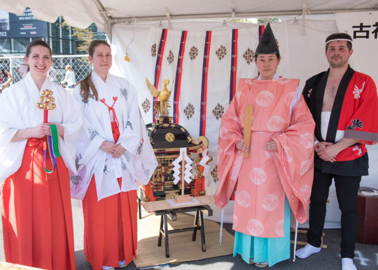 2018 Sakura Matsuri - Reverend Kuniko Kanawa leads students carrying a shrine in front of the U.S. Capitol Building.